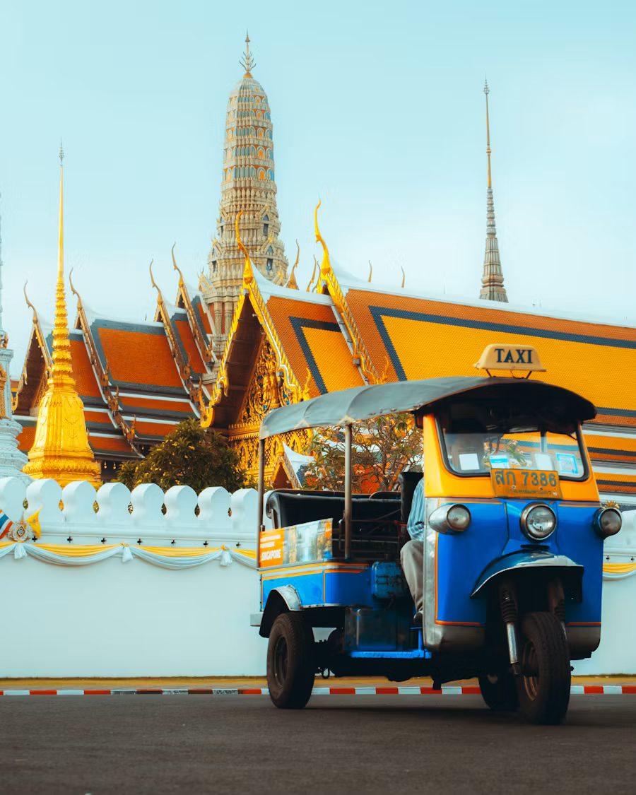 Tuk-tuk in front of a temple in Bangkok