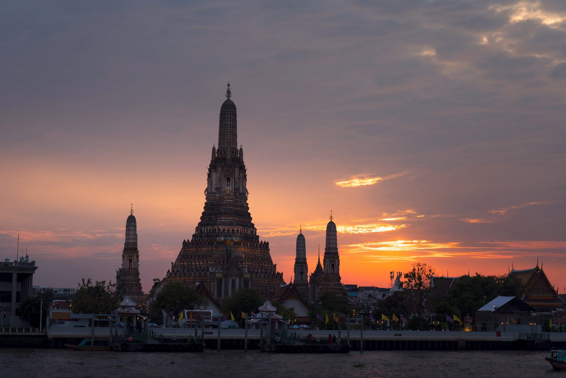 Wat Arun at sunset on the Chao Phraya river